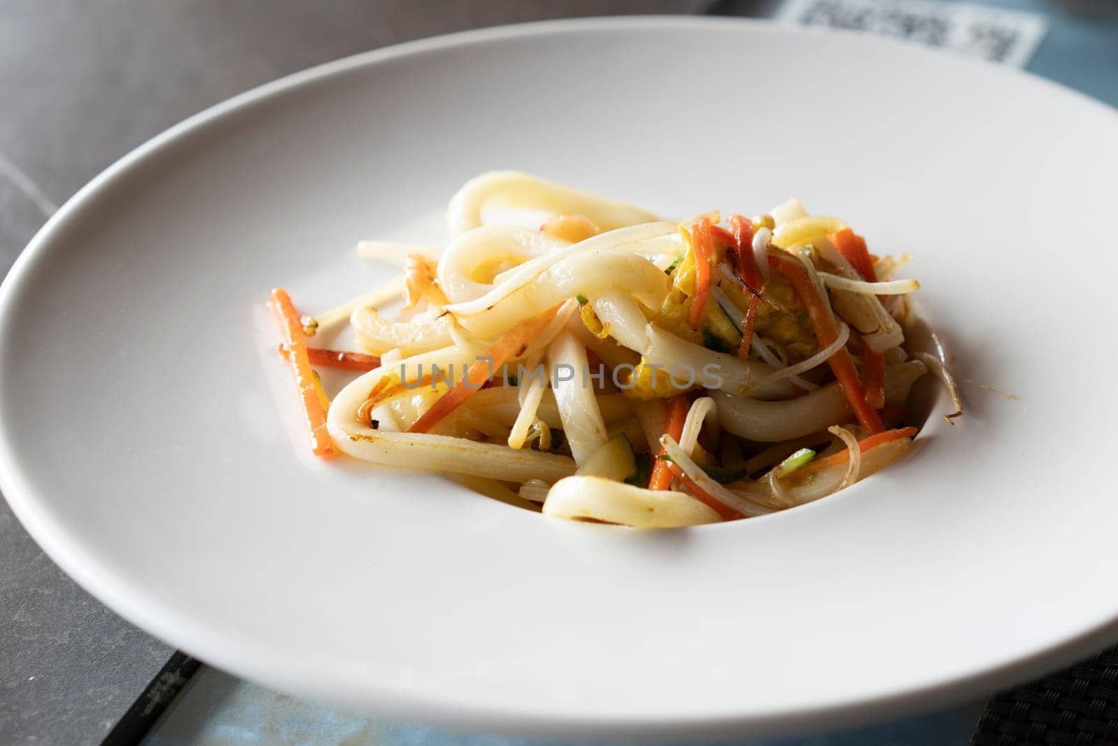 Stir-fried Yaki Udon noodles with shrimps fish, vegetables and soy-based Sauce by Robertobinetti70