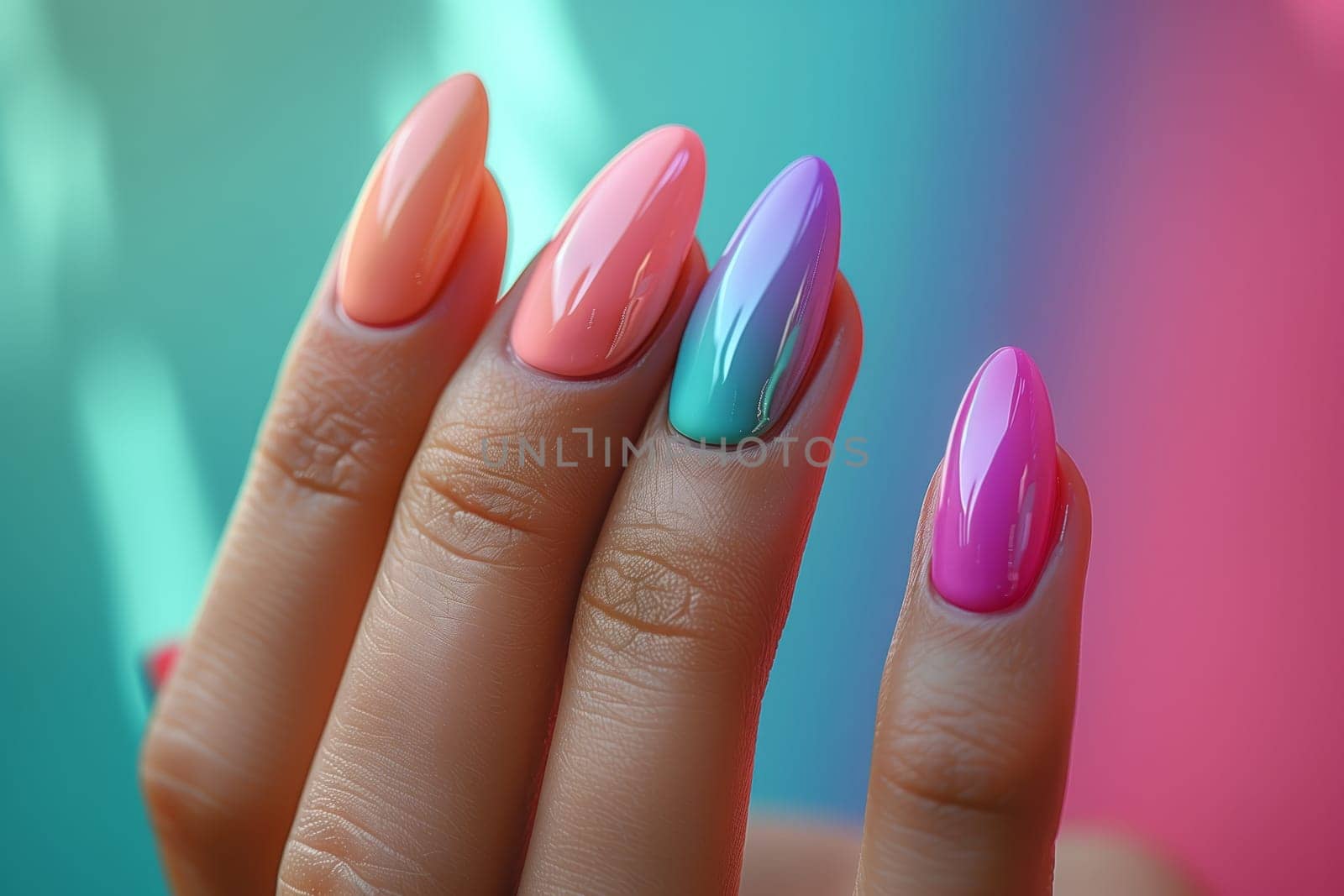 A close up of a womans hand showcasing colorful nail polish in shades of pink and azure, emphasizing nail care and manicure gesture with liquid nail polish