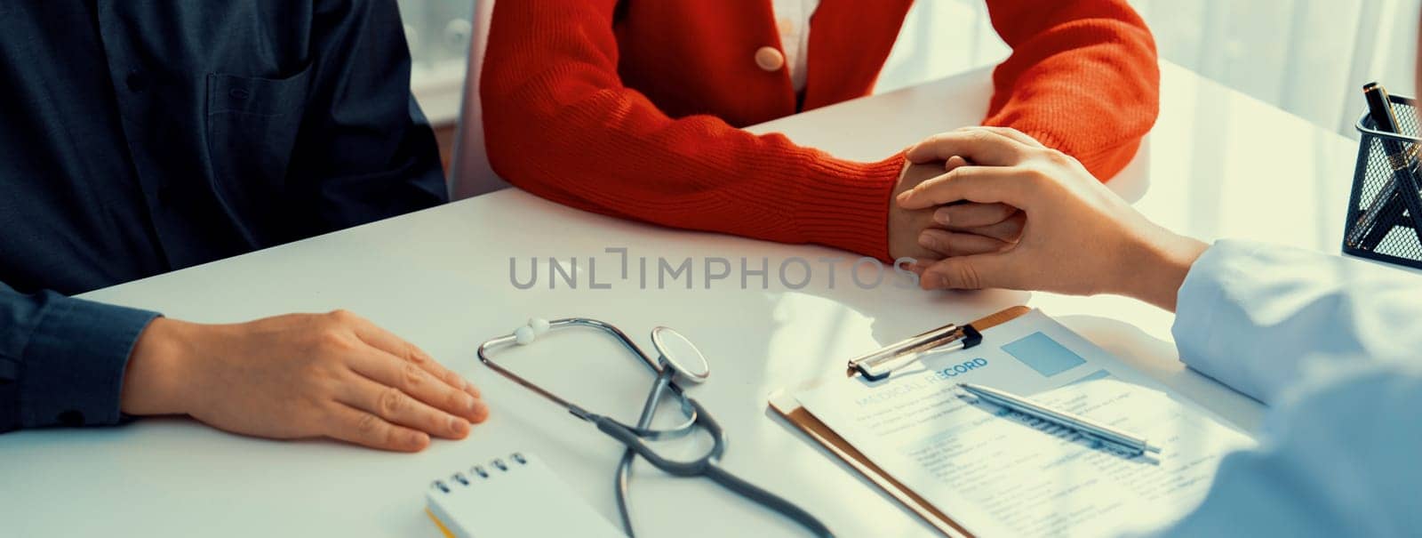 Couple attend fertility consultation with gynecologist at hospital. Rigid by biancoblue