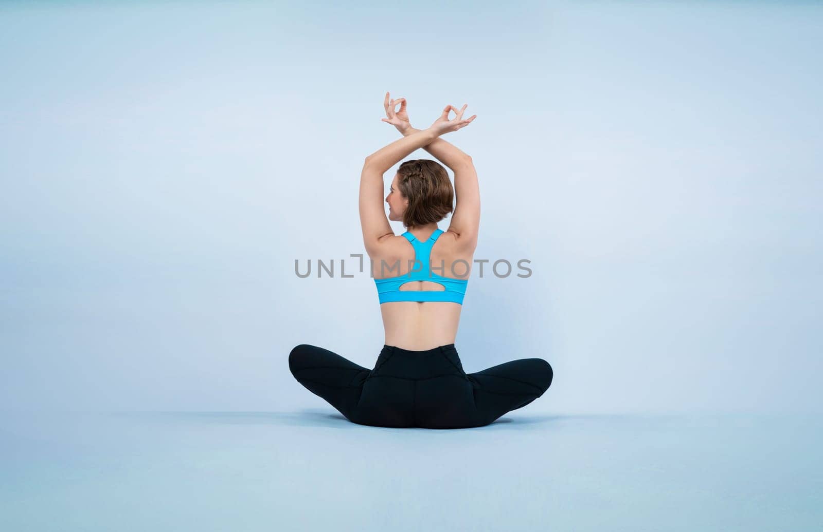 Full body length back rear view gaiety shot athletic and sporty woman doing healthy and meditative yoga exercise workout posture on isolated background. Healthy active and body care lifestyle