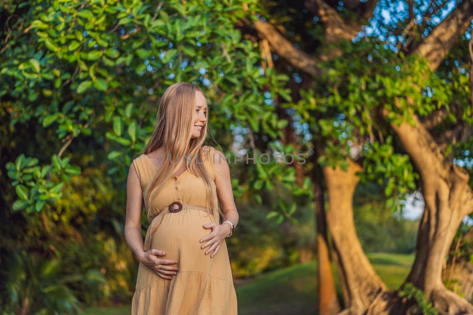 pregnant woman finds joy and serenity, relishing a tranquil moment outdoors during her pregnancy journey by galitskaya