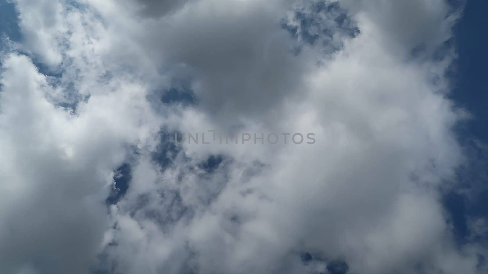 Heavenly white clouds on the blue sky with the sun appeared perfect for multimedia texture or background and content creation