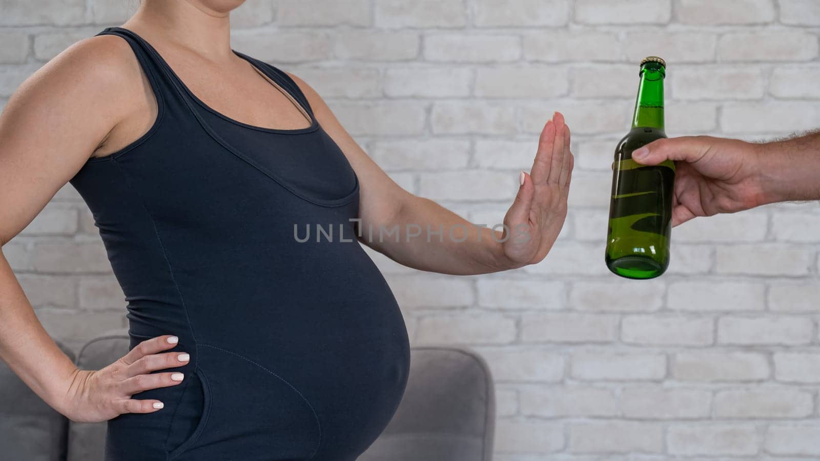 A pregnant woman refuses beer. by mrwed54
