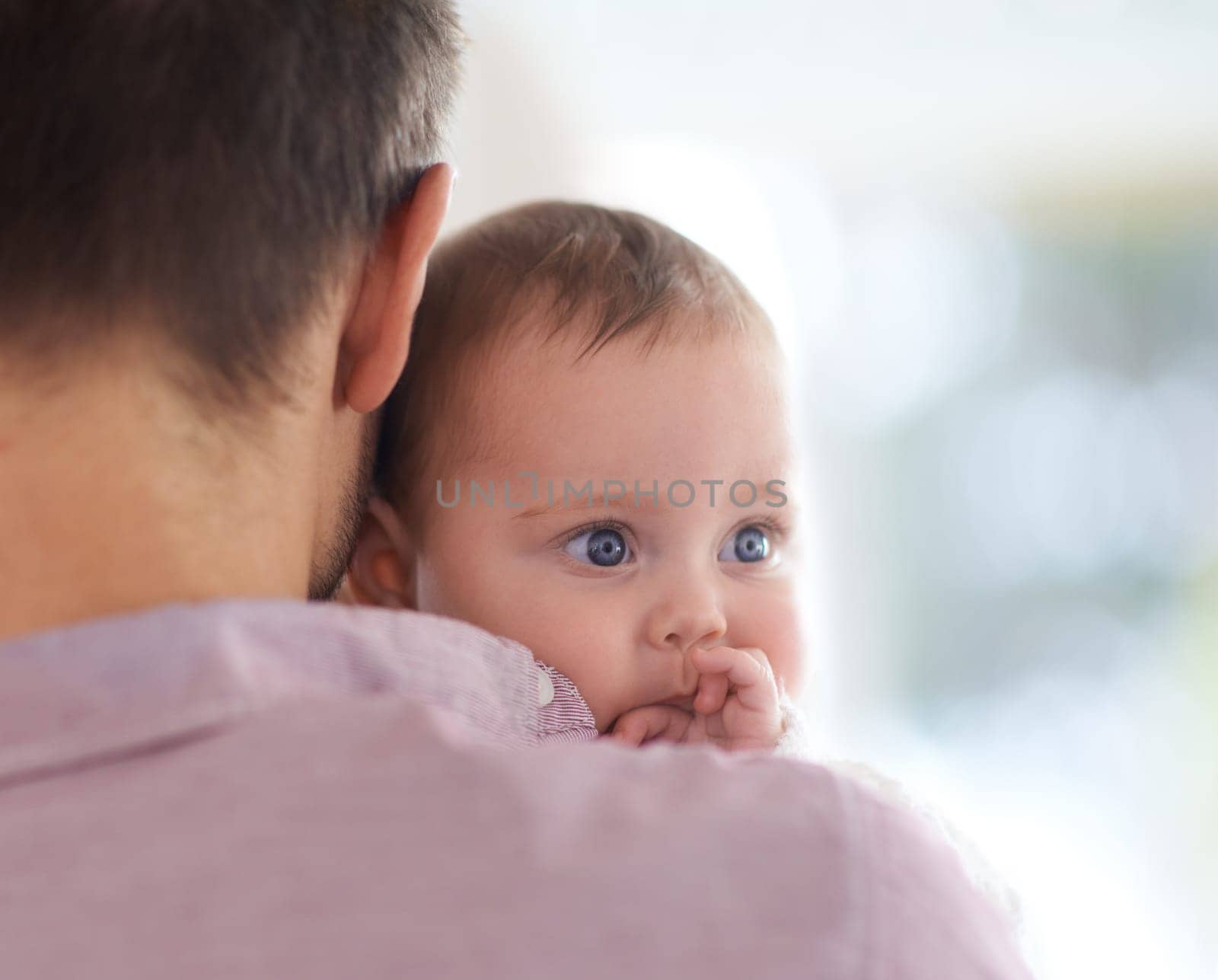 Family, baby and dad at home with love, newborn and care together with parent and bonding. Relax, father and happy in a house with hug of a calm infant with childcare and smile with support and back.