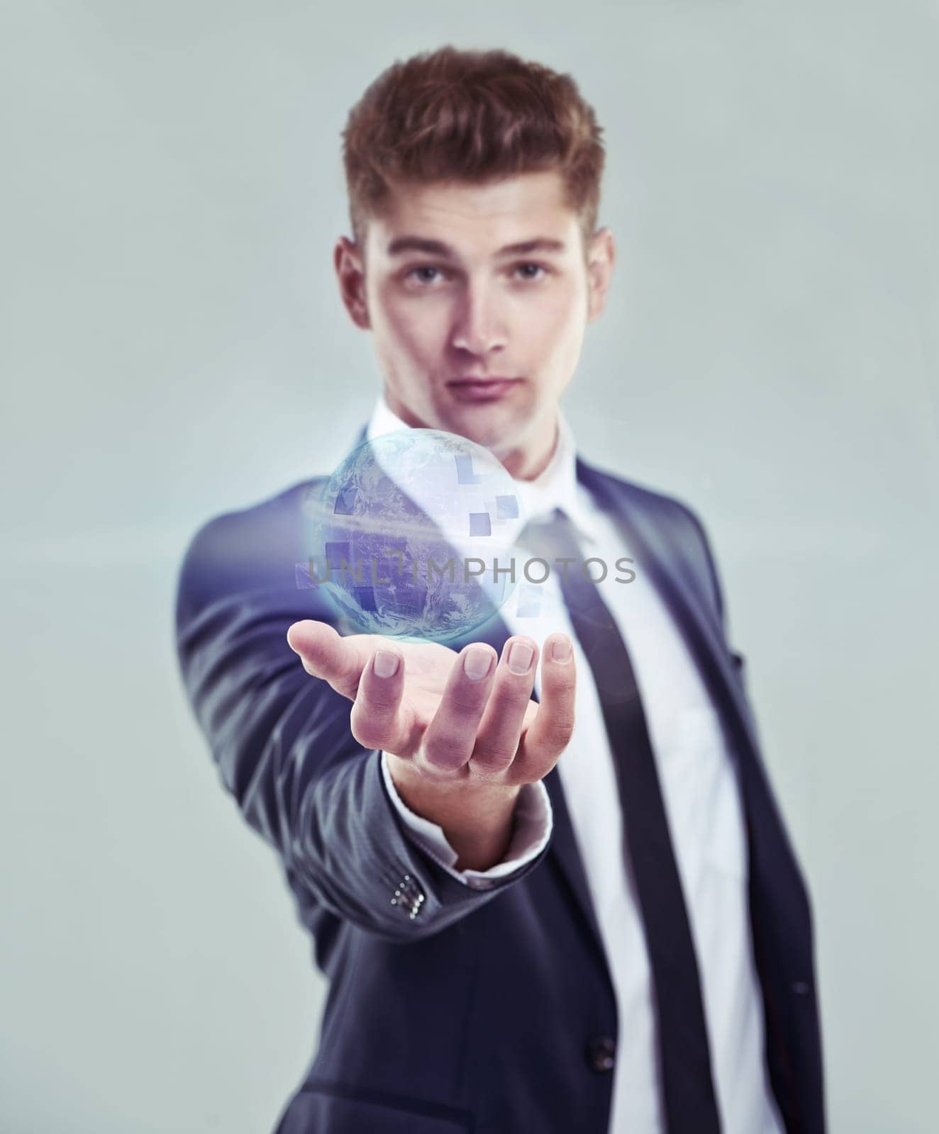 Business, man and world hologram for future, digital age and connect with technology. Internet, communication and online advantage of web globalisation, network and accessibility on grey background.