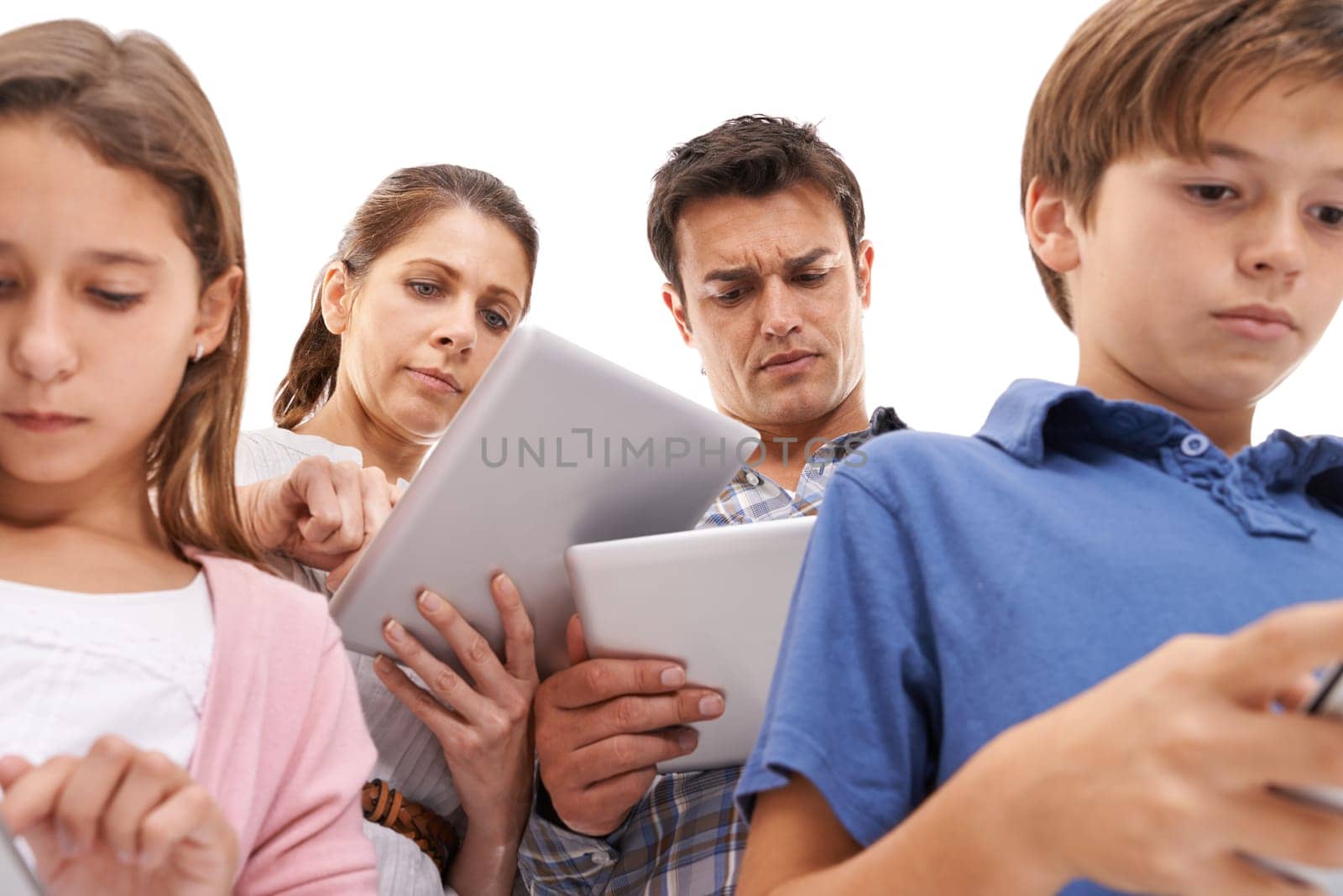 Mother, father and children with tablet for distraction on internet, website and online games. Family, ignore and mom, dad and kids on digital tech for streaming, connection and videos in studio.