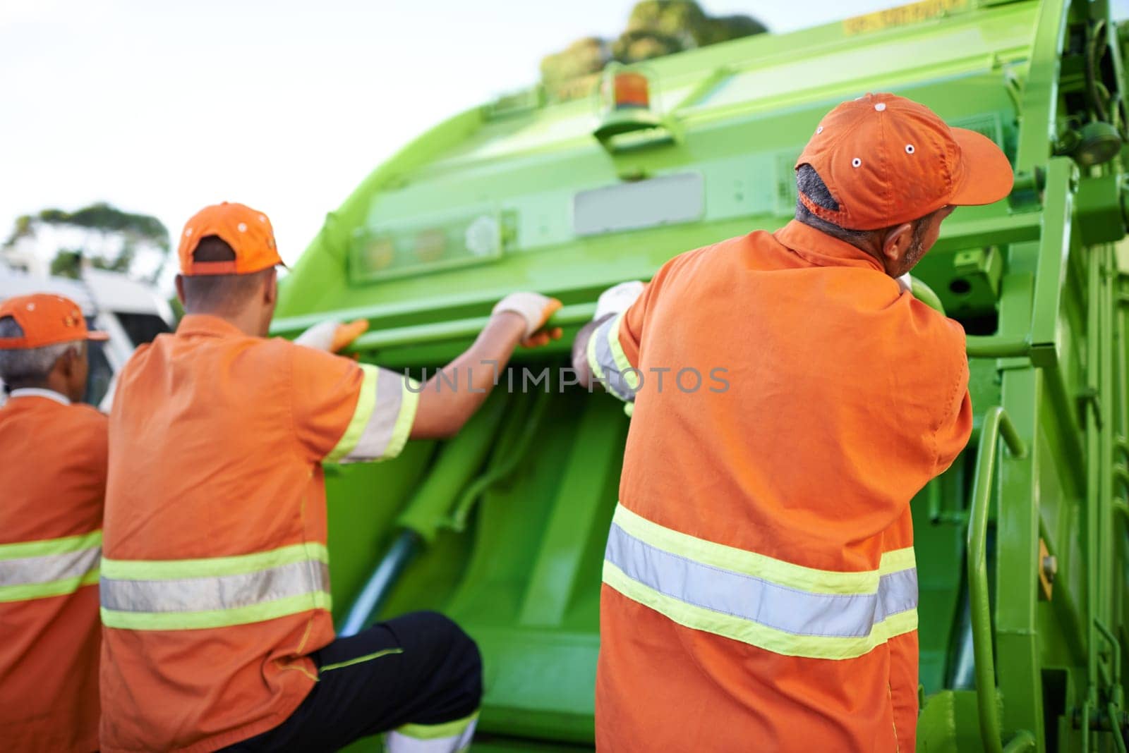 Men, garbage truck and trash collection service for city pollution for cleaning, environment or teamwork. Male people, back and dirt transportation for sidewalk debris in New York, mess or litter.