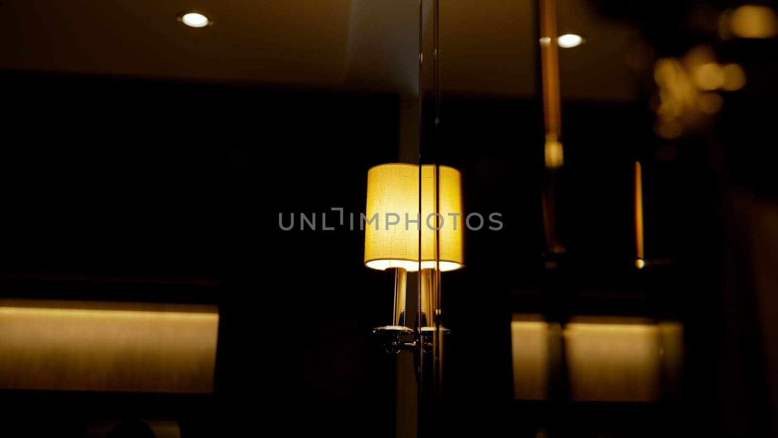 Lamp - a lamp on the wall, close-up. Lamp on the wall. Close-up of a bright lamp on the wall in a luxury hotel. Wall lamp in a hotel room. by Rusrussid