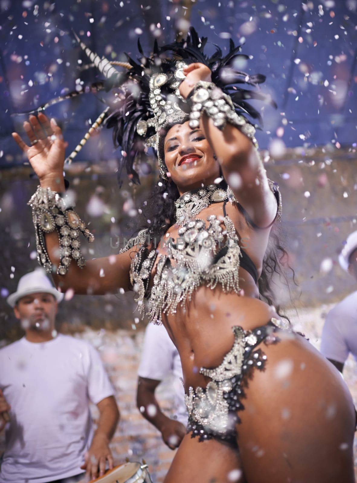 Dance, performance and woman samba at carnival, festival and event in Brazil for summer celebration of culture. Happy, dancer and creative fashion for salsa, party and night with confetti and music by YuriArcurs