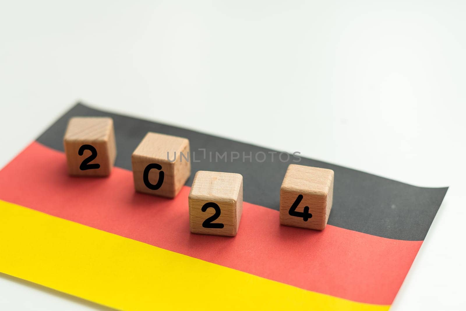 2024, Germany, Germany flag with date block, Concept, Important events for Germany in the new year, election, economy, social activities, central bank, Germany foreign policy. High quality photo