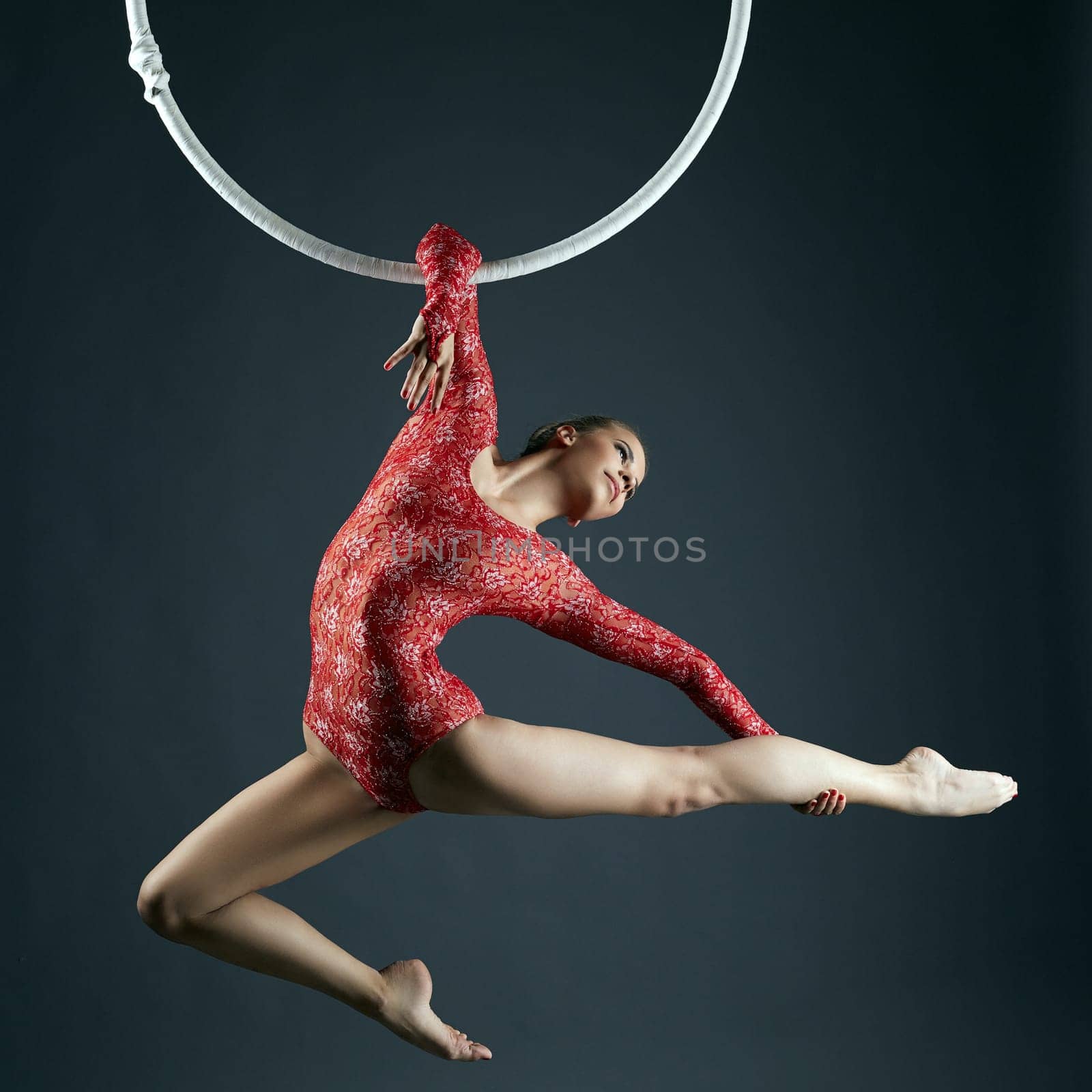Shot of graceful female aerialist posing at camera by rivertime