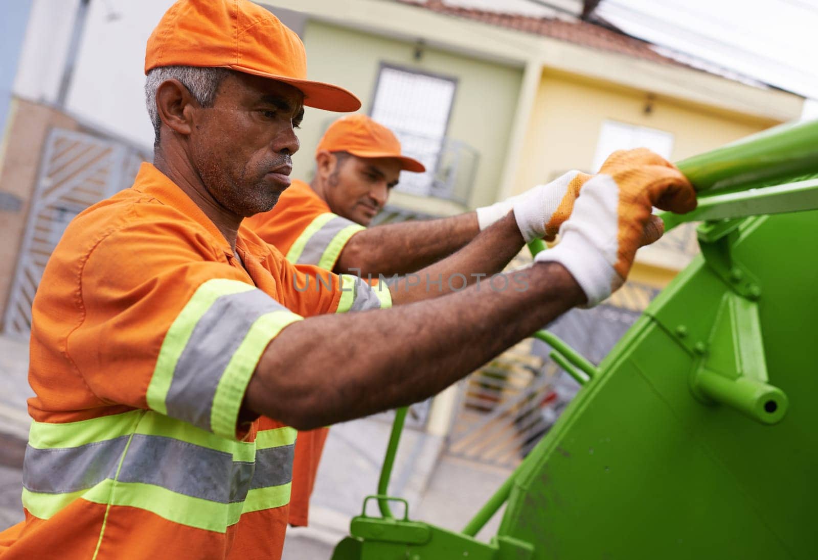 Garbage truck, men and cleaning the city for waste management and teamwork with routine and service. Employees, recycle and sanitation with transportation and green energy with trash and vehicle.