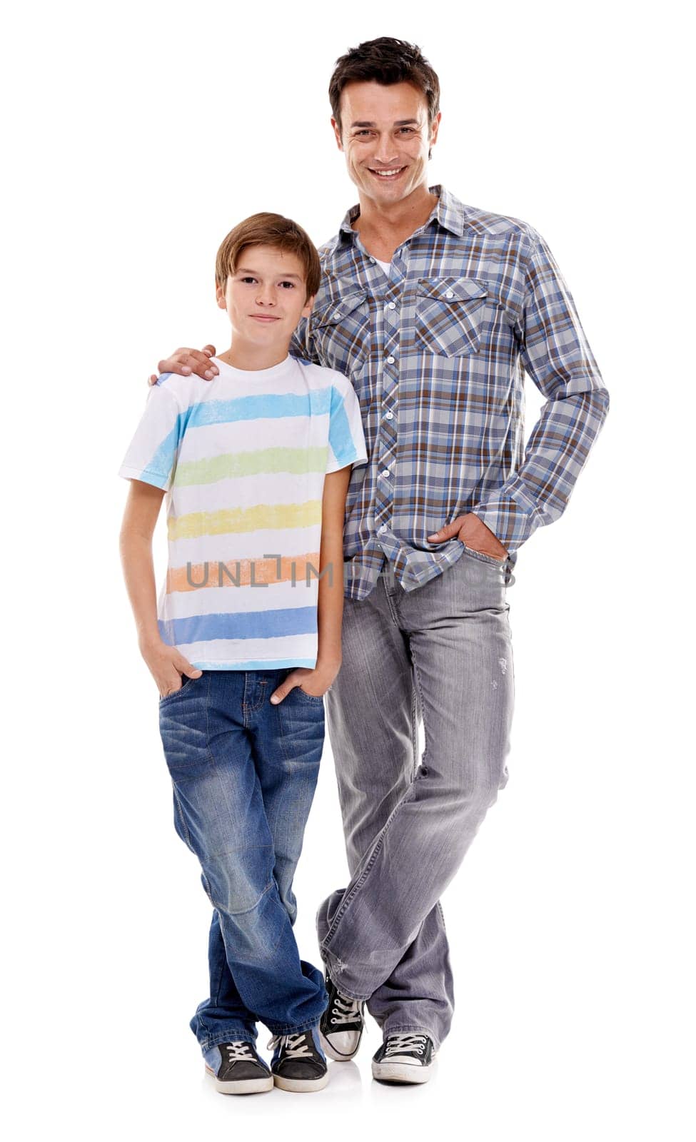 Happy dad, portrait and hug with kid in fashion for family or bonding on a white studio background. Father, son or child with smile in casual clothing, support or trust for parenthood or childhood.
