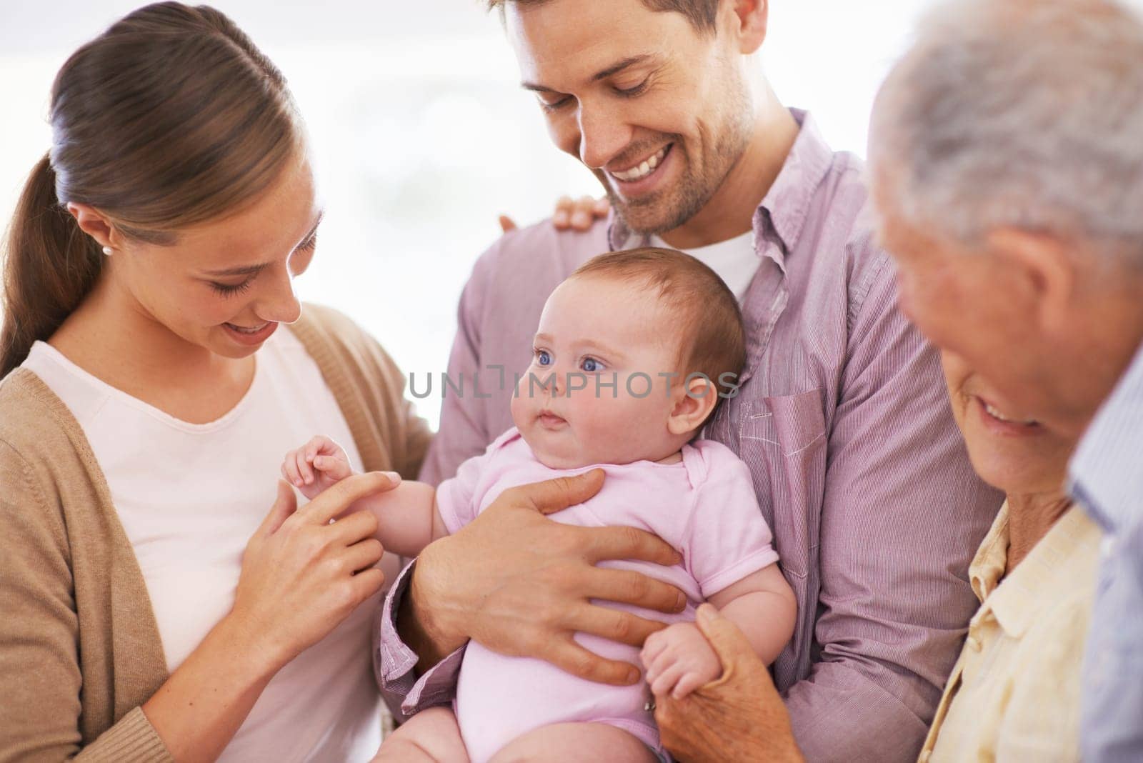 Family, grandparents with baby and parents are happy at home, people bonding with love and relationship. Support, trust and care, smile for pride and generations, childhood and connect with infant by YuriArcurs