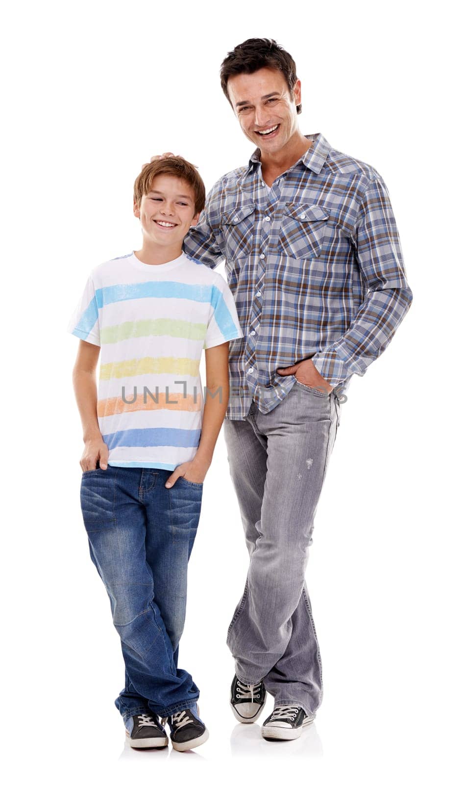 Happy father, portrait and hug with kid in fashion for family or bonding on a white studio background. Dad, son or child with smile in casual clothing, support or trust for parenthood or childhood.