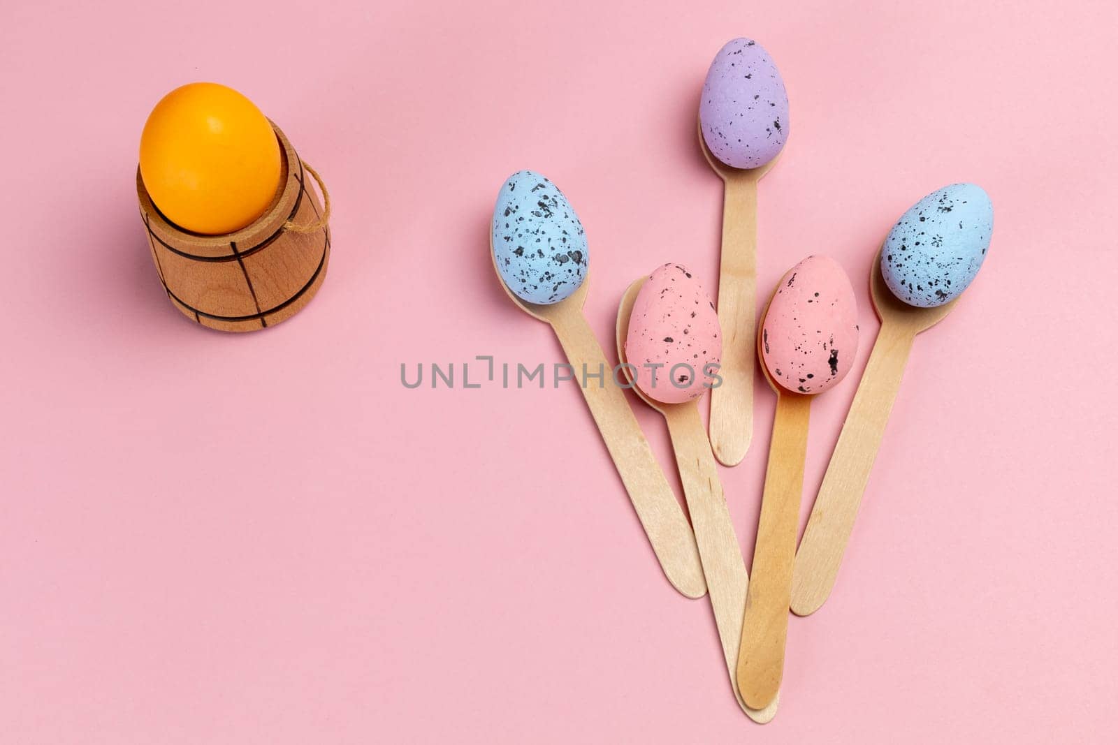 Colored Easter eggs with the wooden spoons. by mvg6894