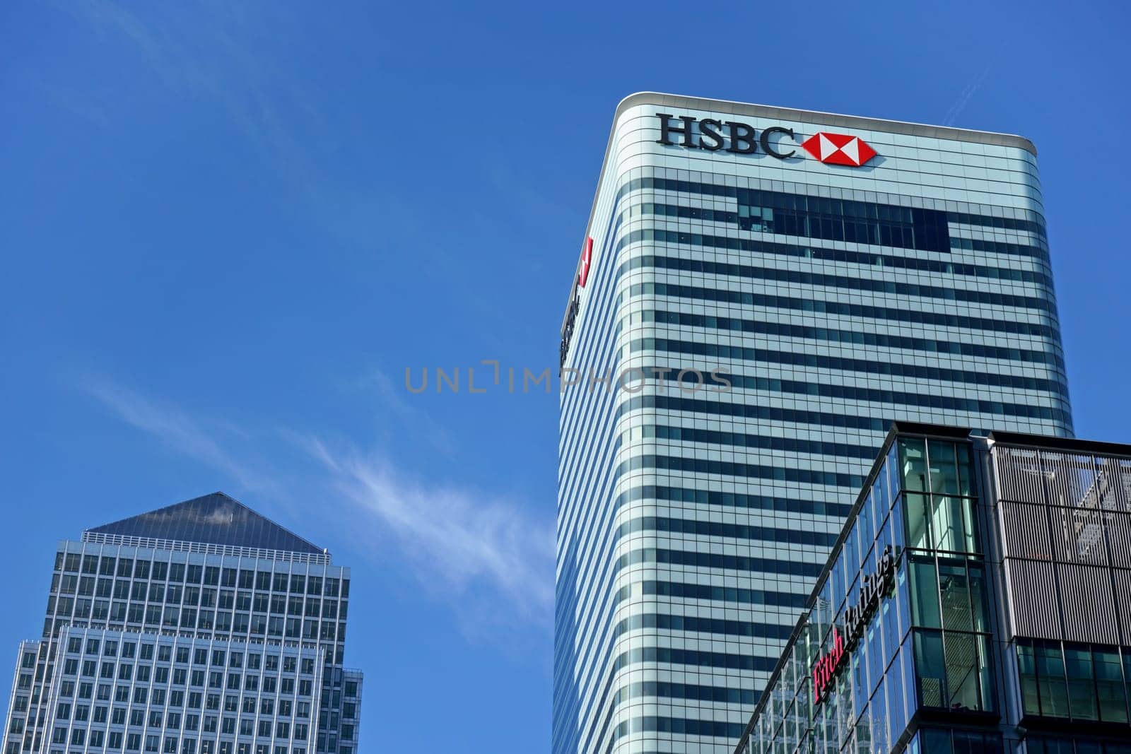 London, United Kingdom - February 03, 2019: Sun shines on world Headquarters of HSBC Holdings plc at 8 Canada Square, Canary Wharf. It's 7th largest bank worldwide and was established in 1865 by Ivanko