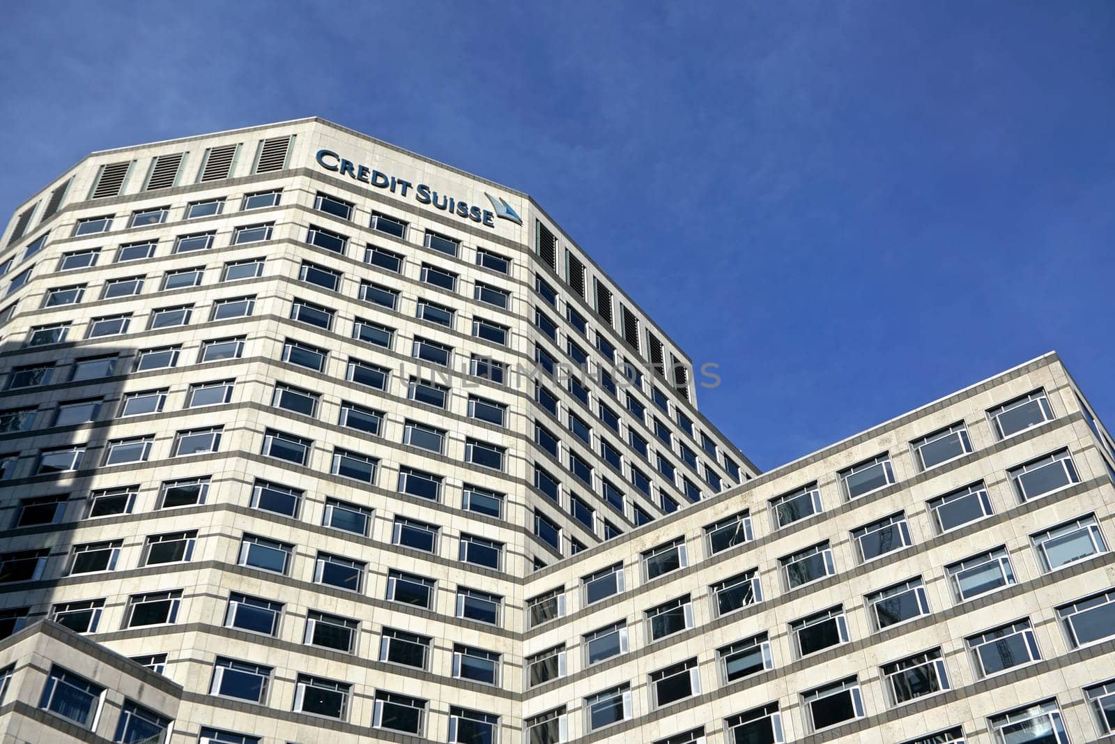 London, United Kingdom - February 03, 2019: Modern offices of UK branch of Credit Suisse at Canary Wharf. CS Group AG is multinational investment bank founded in 1856 by Ivanko