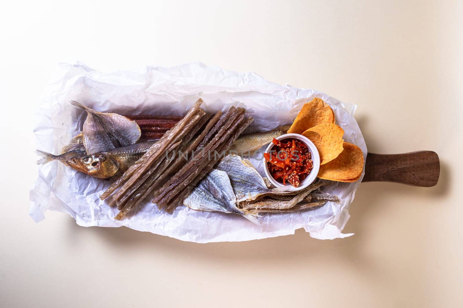 Top view of assorted dry fish for beer. fish on a wooden board.