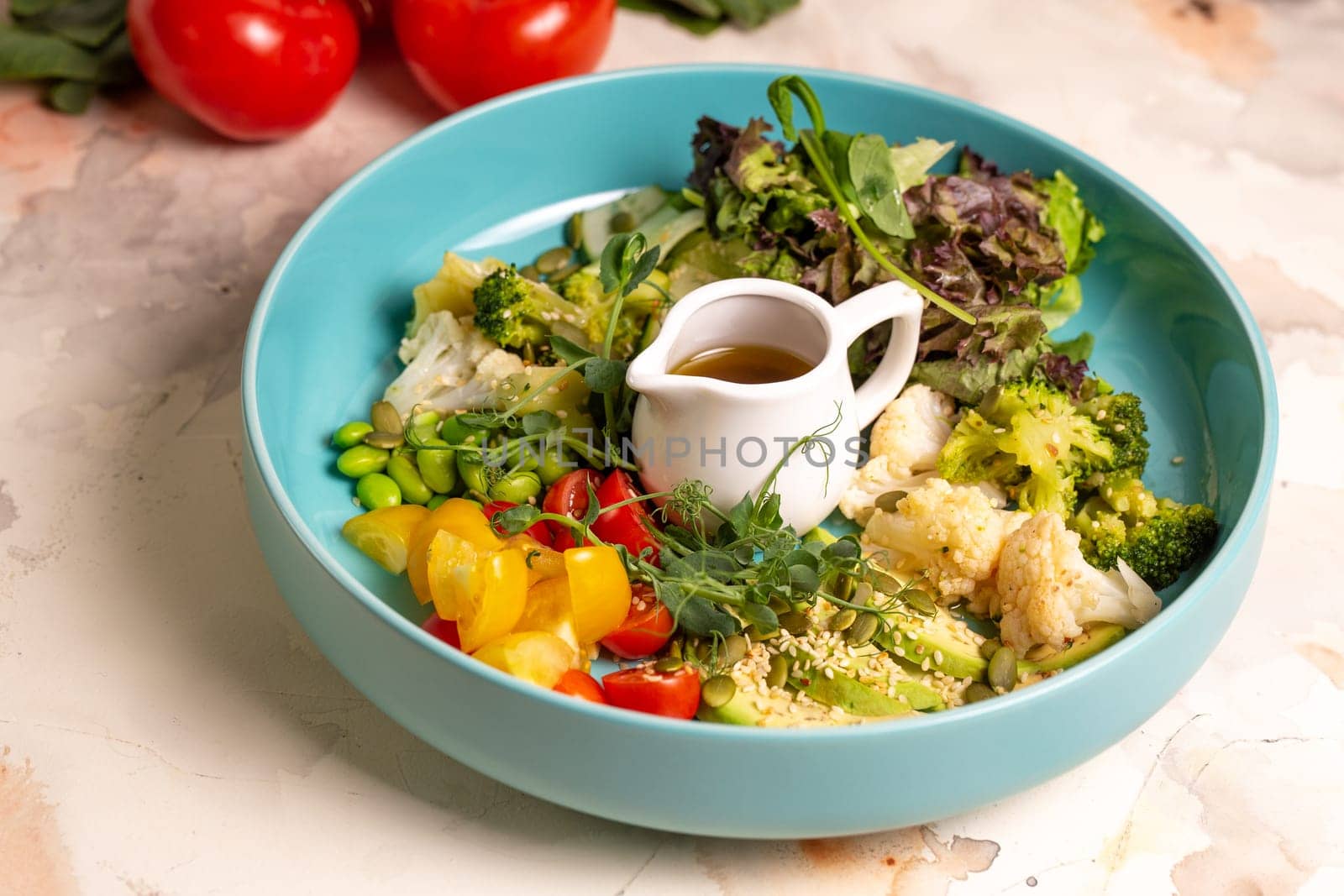 Salad Bowl. Assortment of fresh vegetables, colorful salad, and zesty dressing on a plate. Encouraging a balanced and nutritious diet.