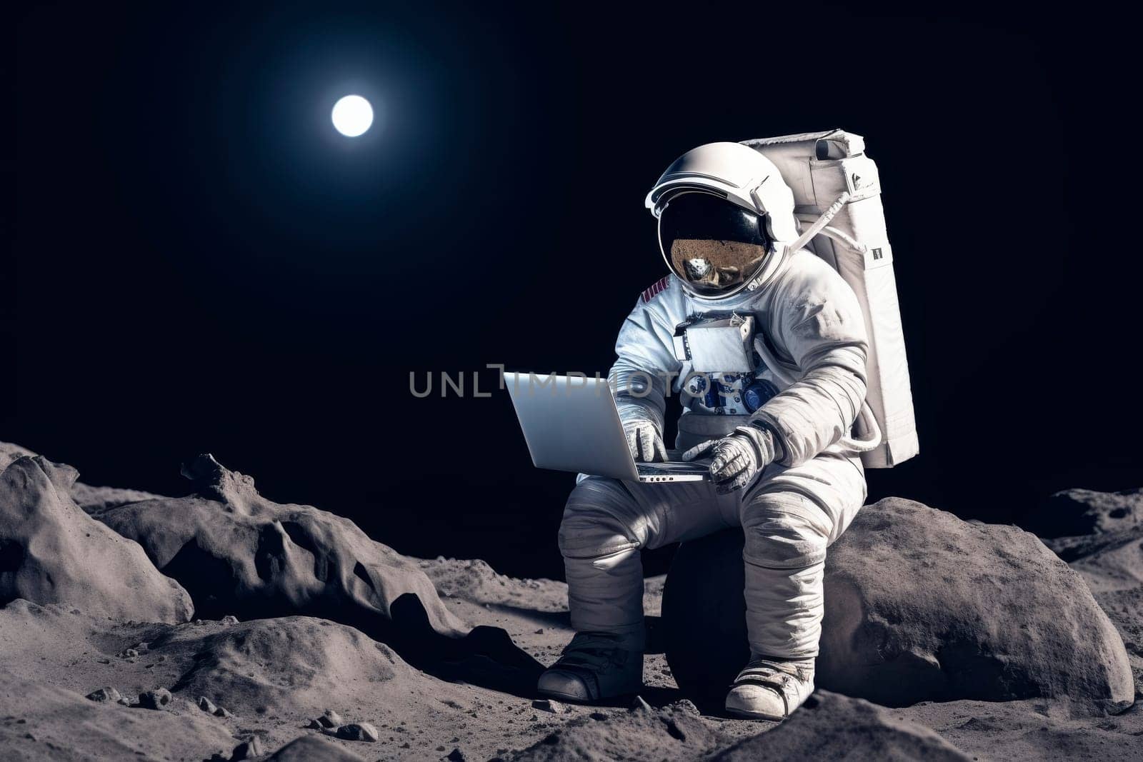 Astronaut with laptop sitting on moon's surface