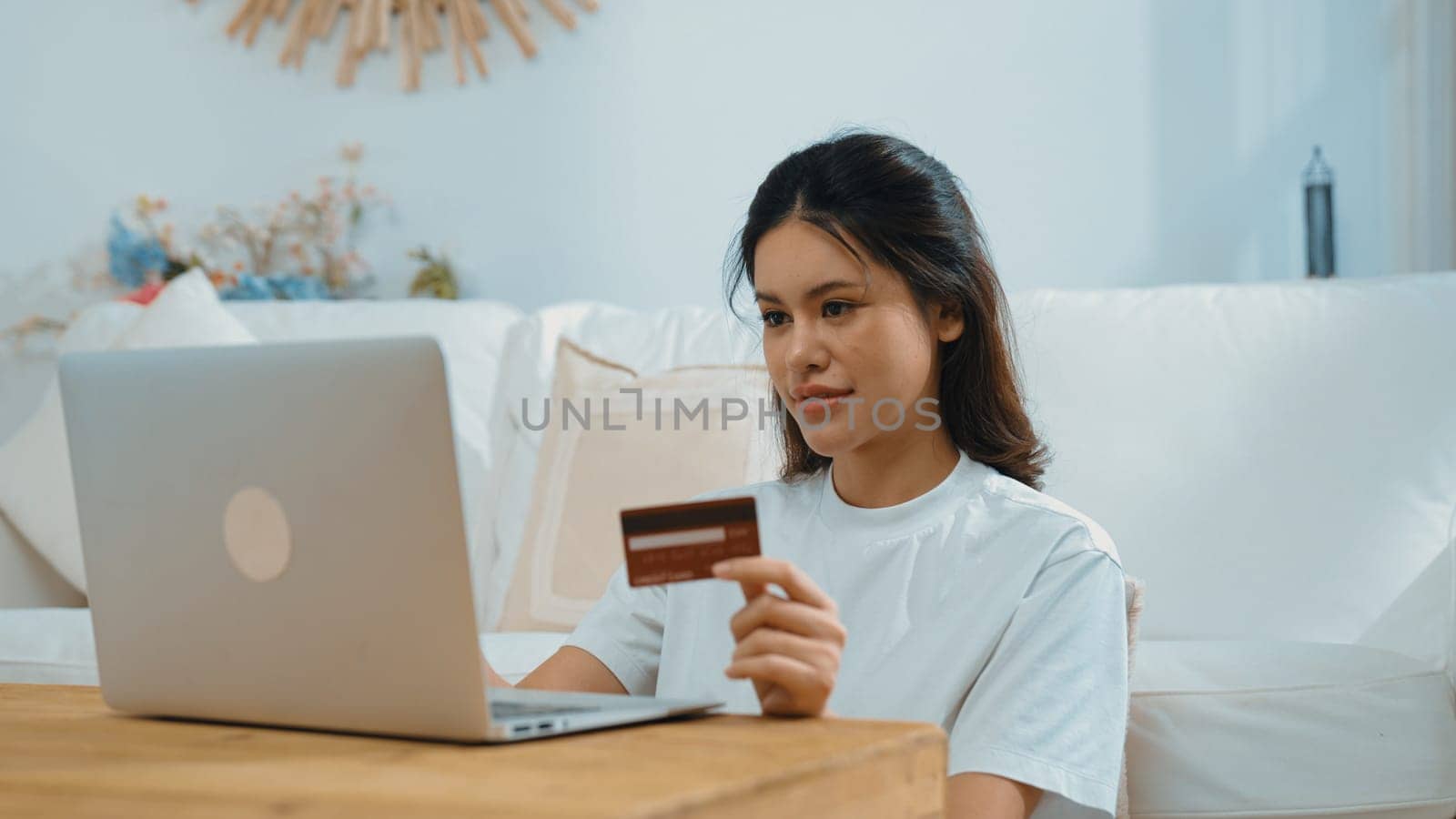 Woman shopping or pay online on internet marketplace browsing for sale items for modern lifestyle and use credit card for online payment from wallet protected by vivancy cyber security software