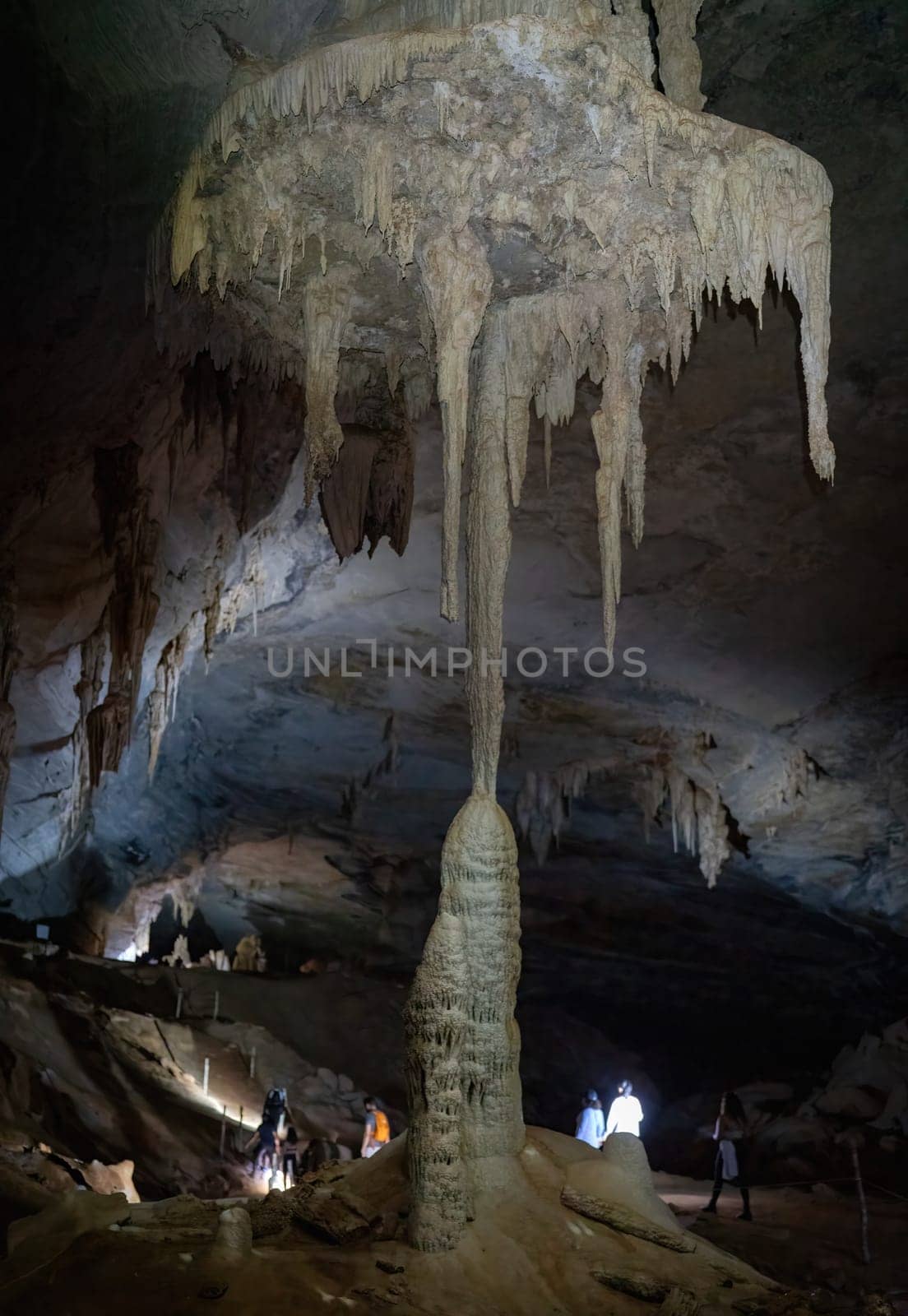 Tourists excited by union of stalactites and stalagmites in Lamp Union. by FerradalFCG