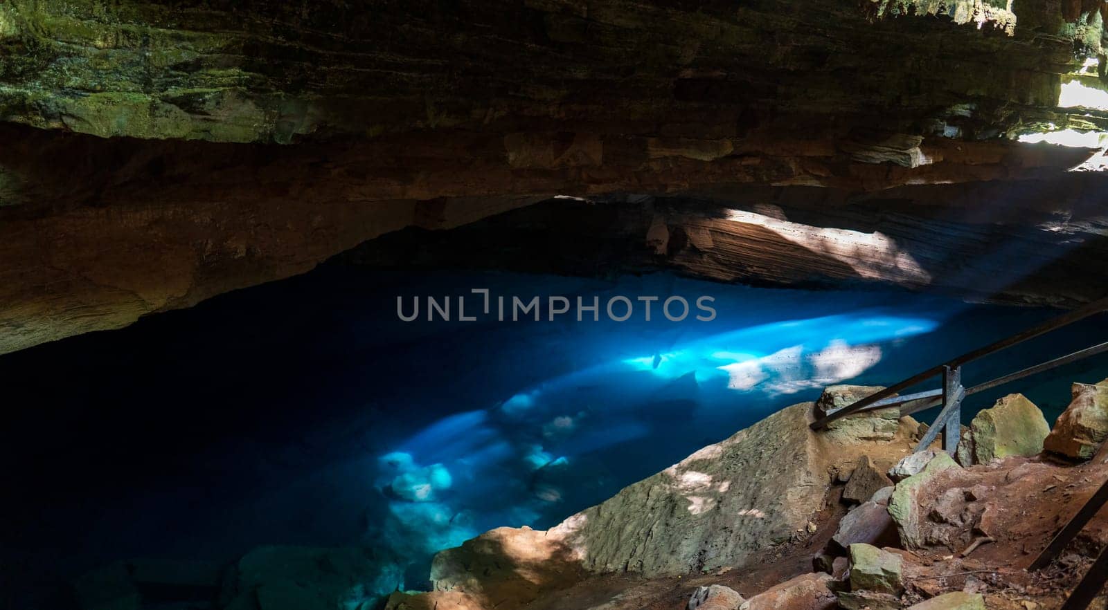 Ethereal Blue Light Shining Through a Serene Cave by FerradalFCG