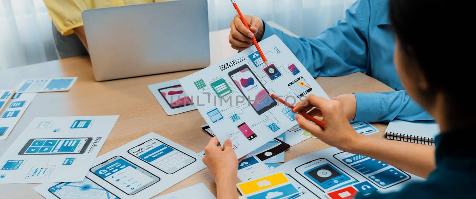 Panorama banner of startup company employee planning on user interface prototype for mobile application or website in office. UX UI designer brainstorm user friendly interface plan. Synergic