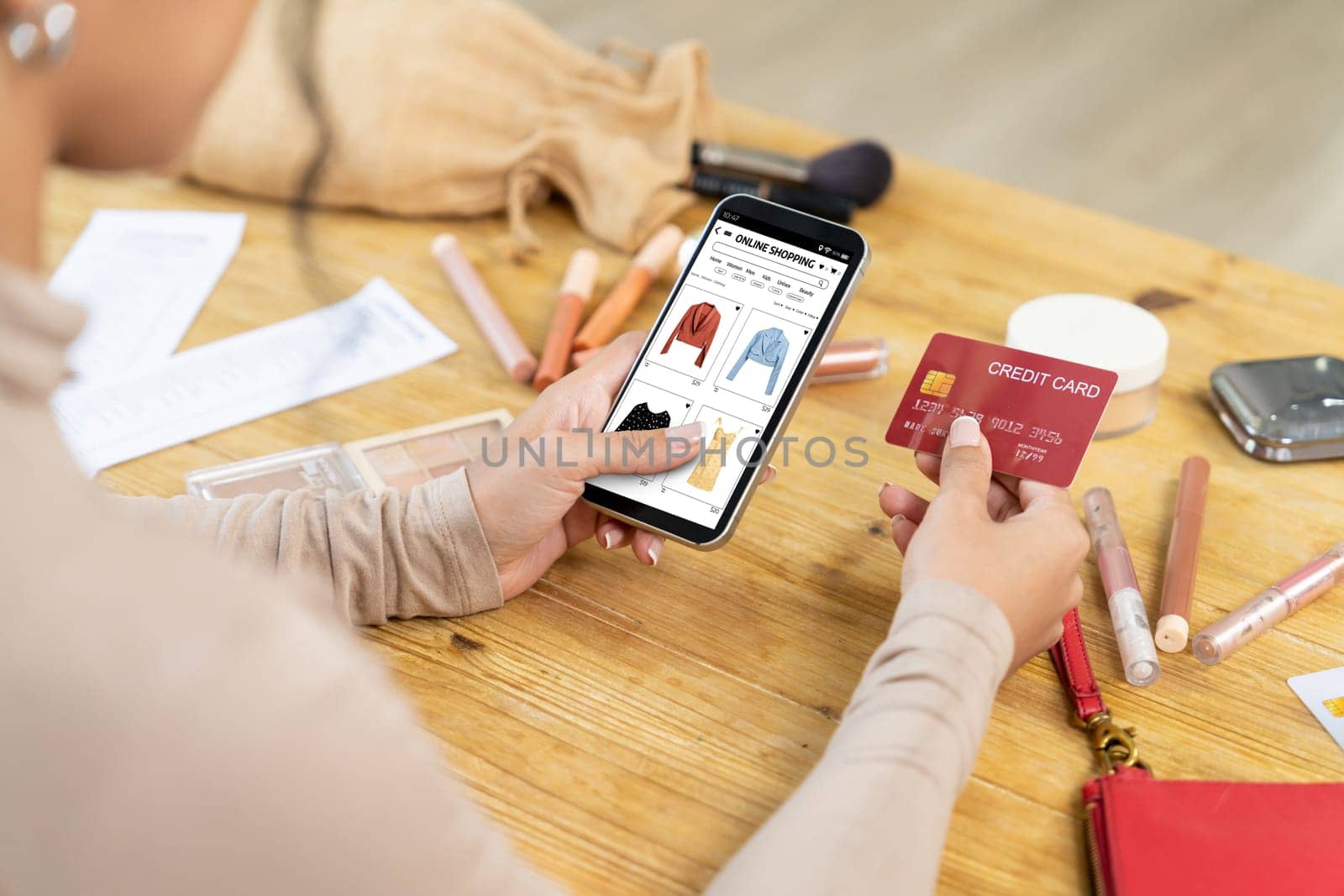 Woman shopping online on internet marketplace browsing for sale items for modern lifestyle and use credit card for online payment from wallet protected by crucial cyber security software