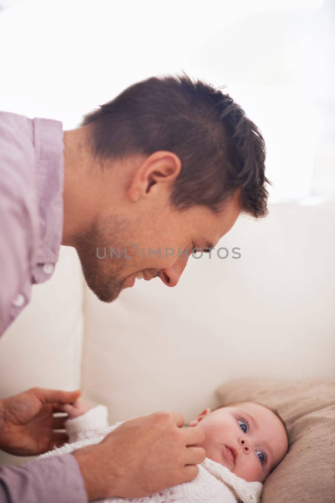 Family, baby and dad on sofa with love, support and care together with parent and bonding. Relax, father and happy in a house with development of a calm infant with childcare and smile and growth.