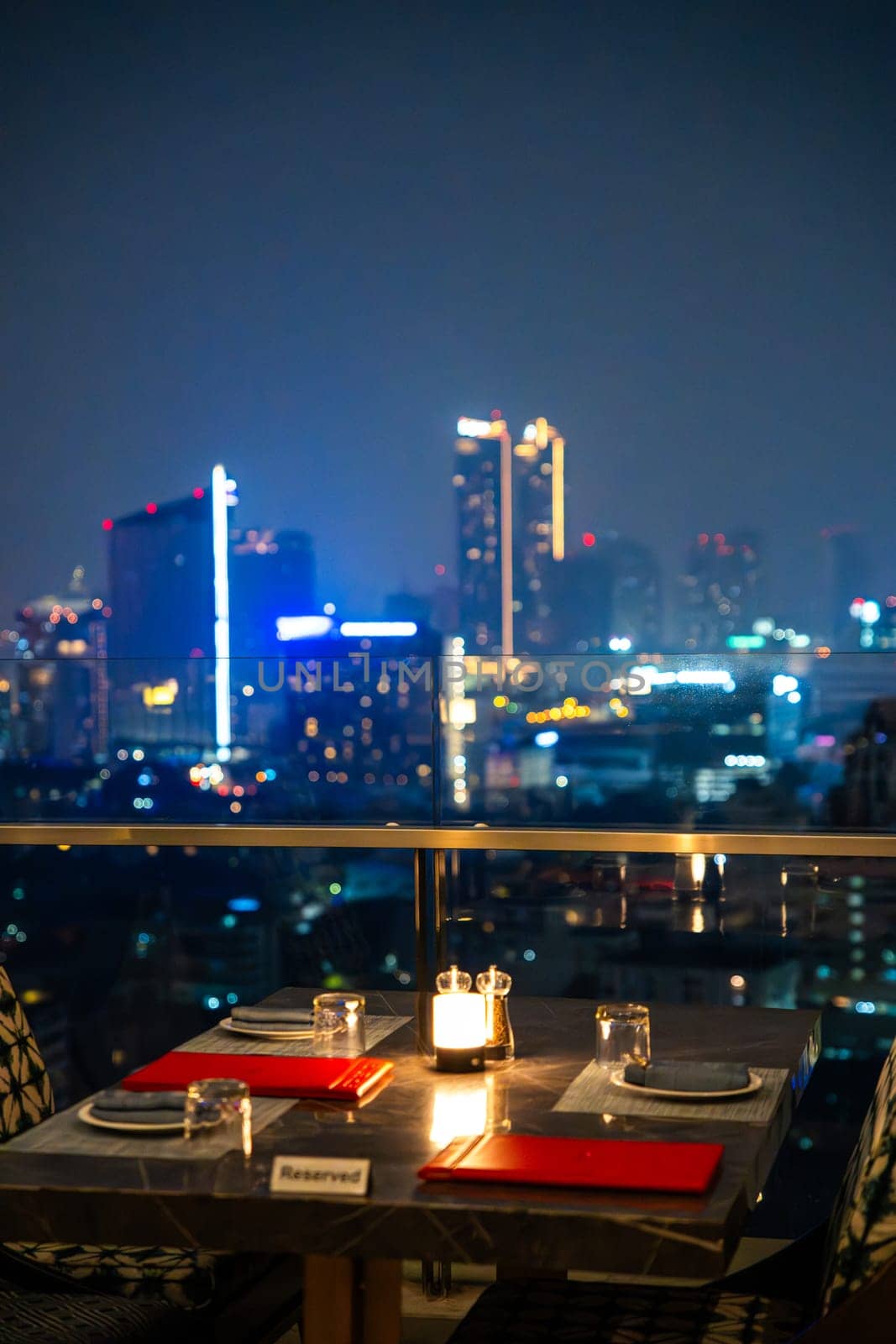 Bangkok skyline view at night from a rooftop restaurant, Bangkok Thailand. High quality photo