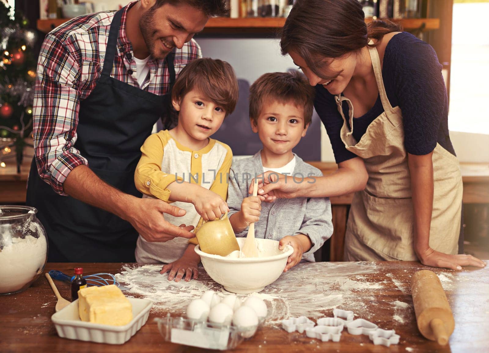 Family, smile and portrait of kids baking in kitchen, learning or happy boys bonding together with parents in home. Father, mother or face of children cooking with flour, dessert or teaching brothers by YuriArcurs