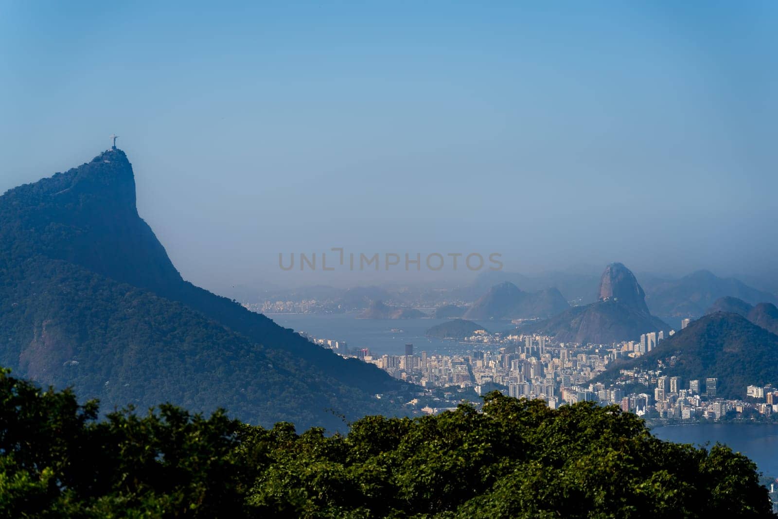 Overlooking Rio de Janeiro, the photo captures stunning Sugarloaf Mountain and the famed Christ the Redeemer.