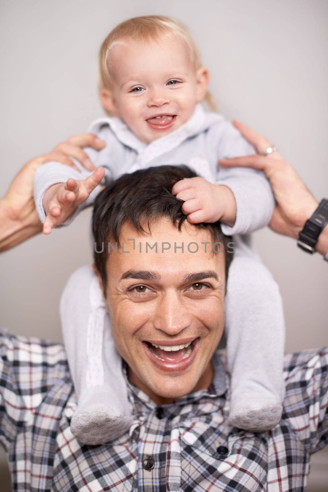 Love, portrait or father and baby with piggyback, playing or bonding at home with shoulder games. Child development, learning and face of dad with girl having fun, support and laughing in family time by YuriArcurs