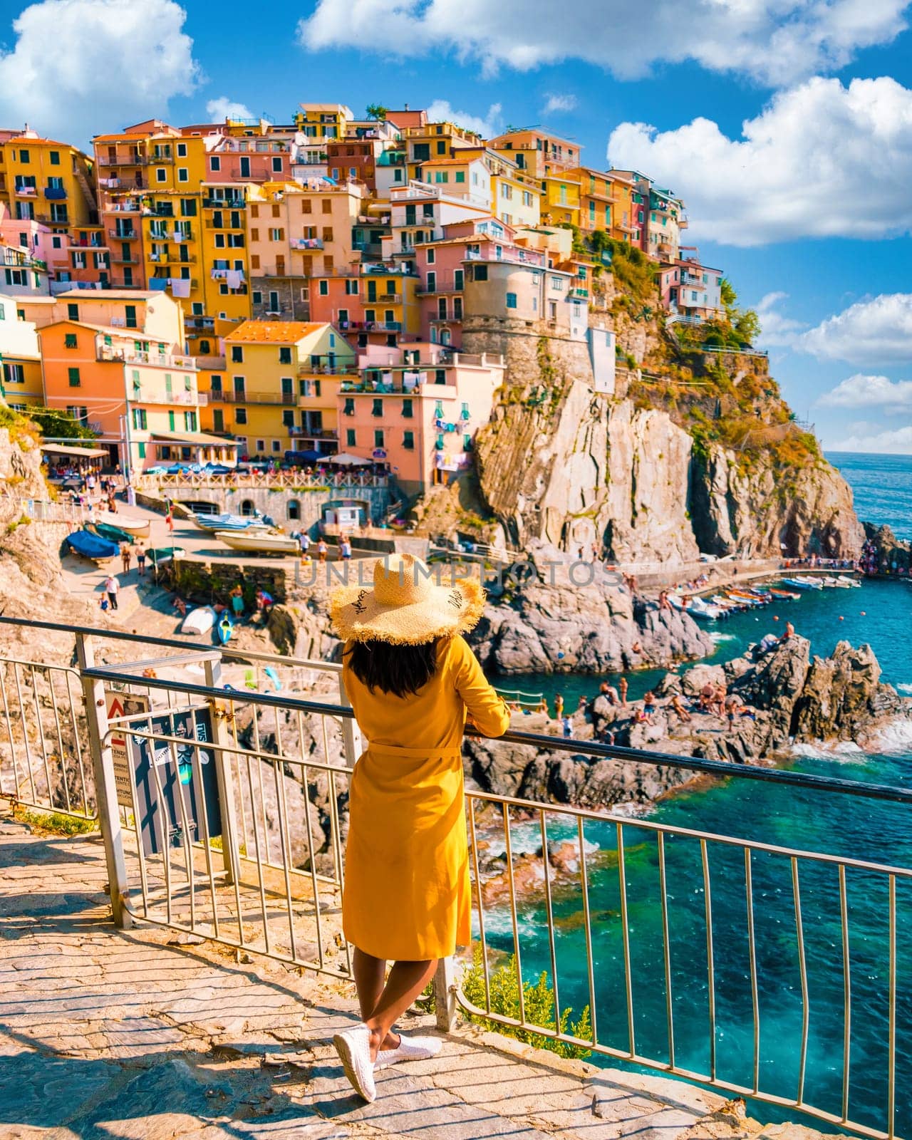 Asian women visiting Manarola in Cinque Terre Italy by fokkebok