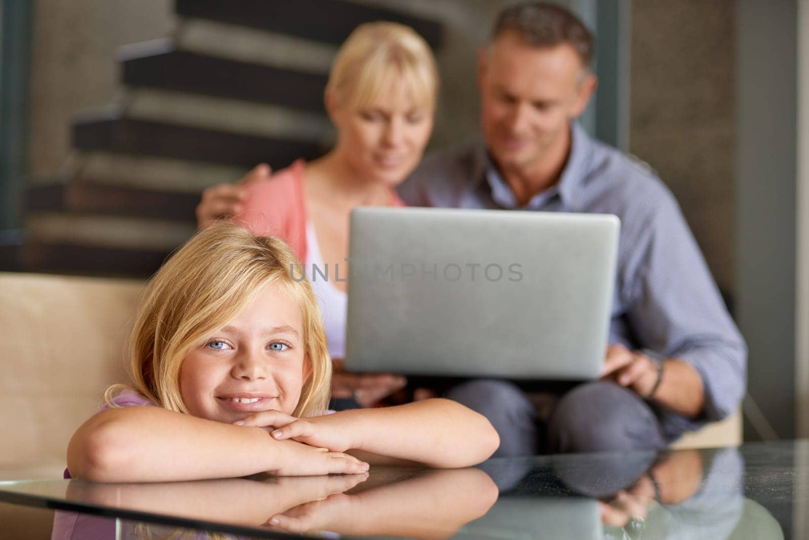 Portrait, happy child and parents in lounge with love, relax and laptop for movie on weekend in house. Father, mother or daughter face with smile for care in home or stream for online subscription.