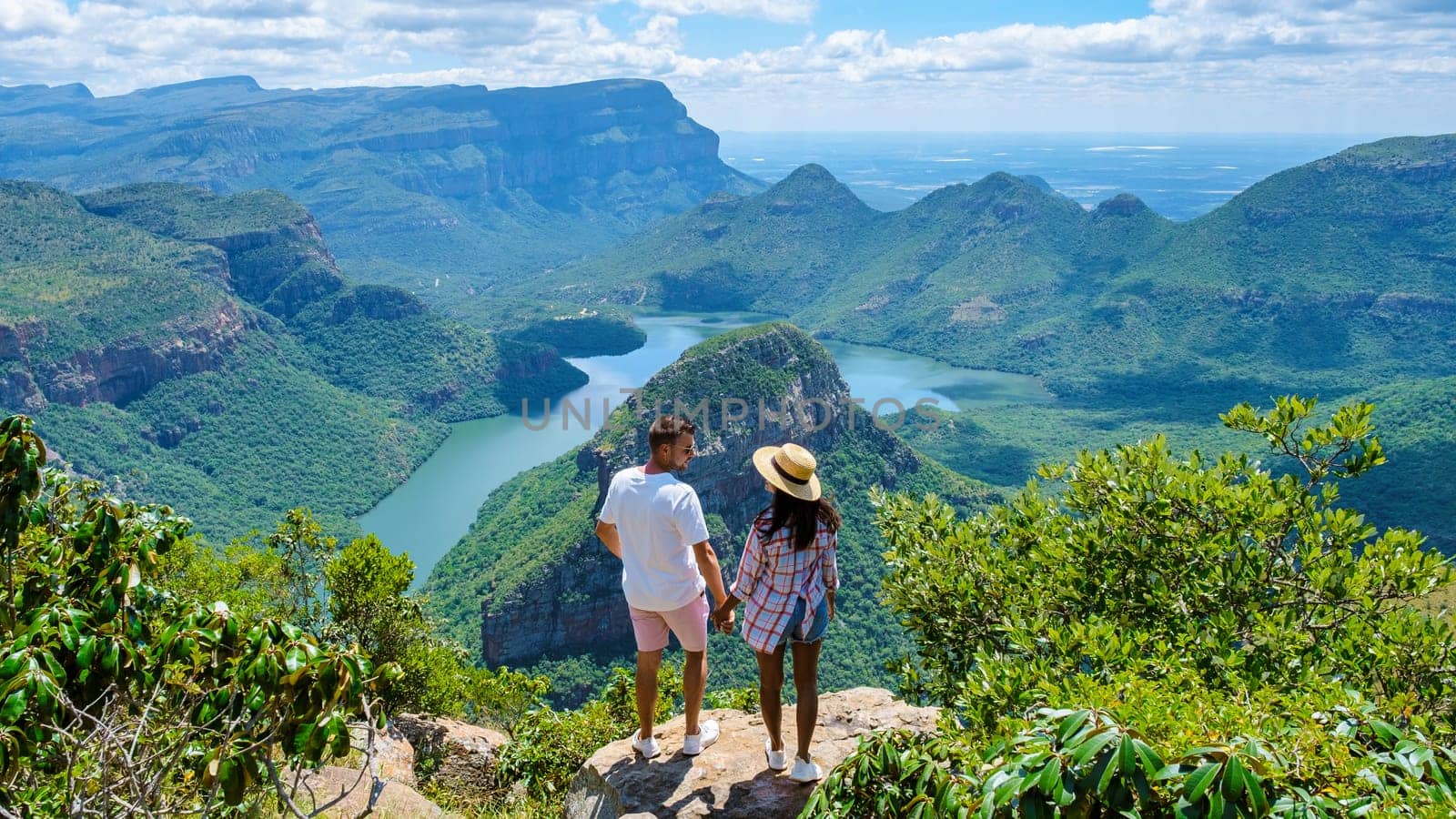 couple visit the Panorama Route South Africa, Blyde river canyon with the three rondavels by fokkebok