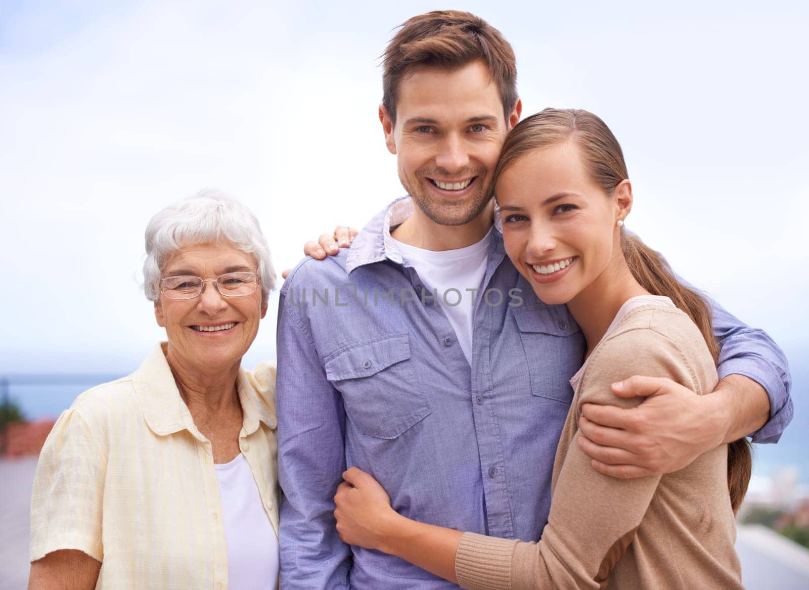 Happy, family and portrait of mother with couple, husband and wife. Embrace and smiling with love and joy for senior woman at outdoor with bonding on a peaceful day for reunion and affection by YuriArcurs