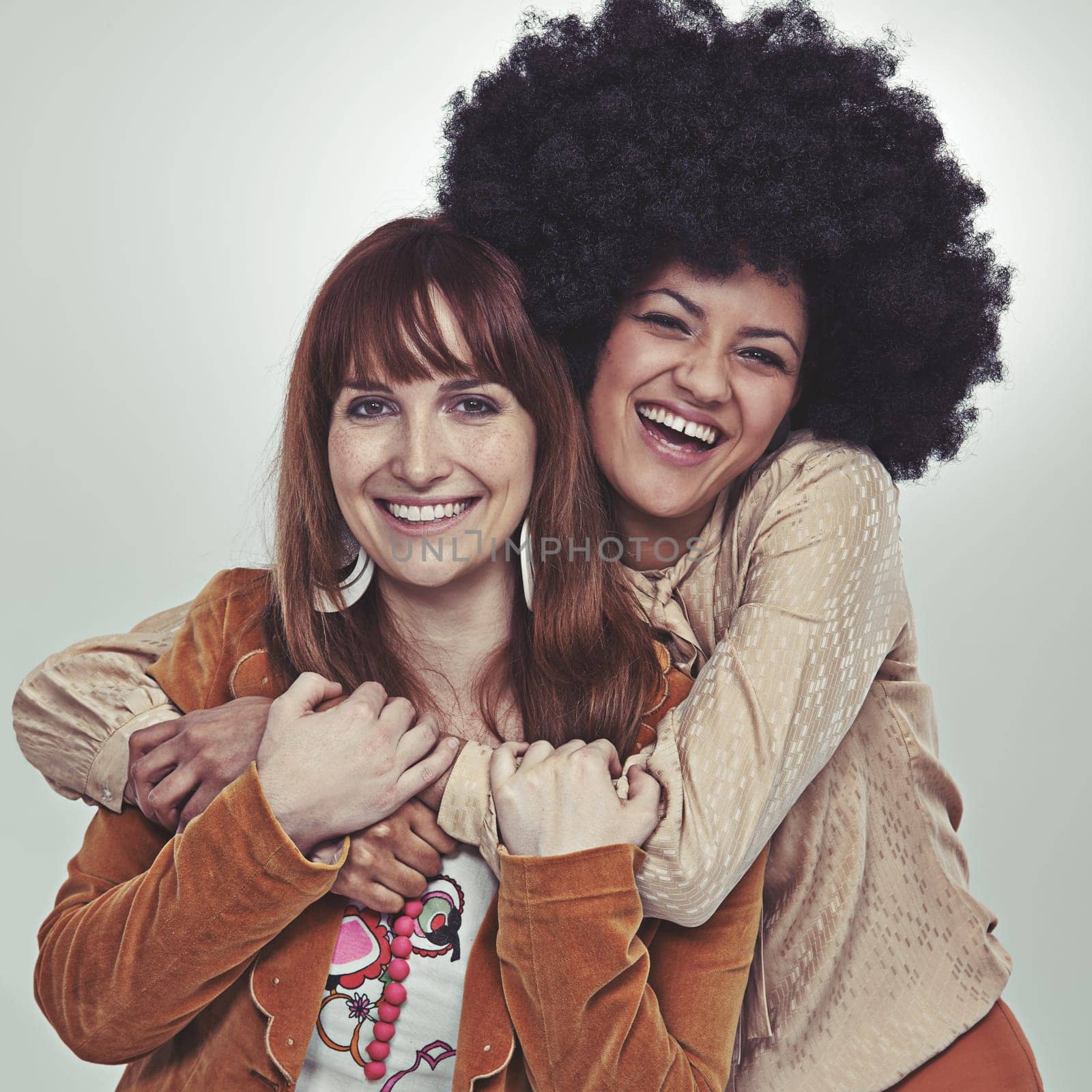 Vintage, portrait and friends with retro style, smile and laugh with hug in studio with grey background. Girls, happiness and unique with fashion in outfits, clothes and women with confidence.