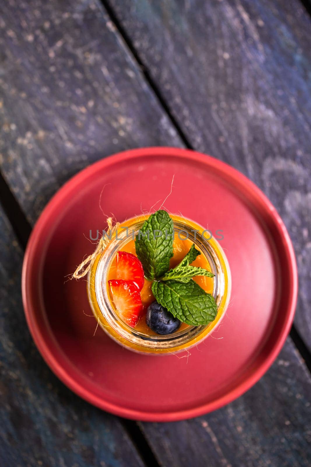 Chia seed pudding with mango, mixed berries, milk, Greek yogurt, assorted fruit, and honey. Tropical-inspired delight for a refreshing summer treat.