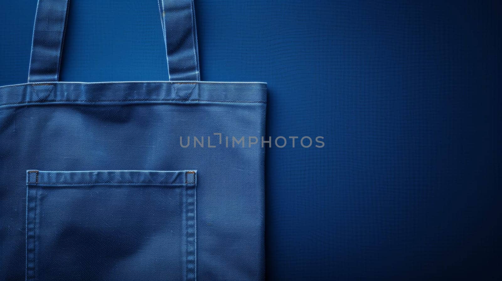 A blue bag with a pocket on the side of it
