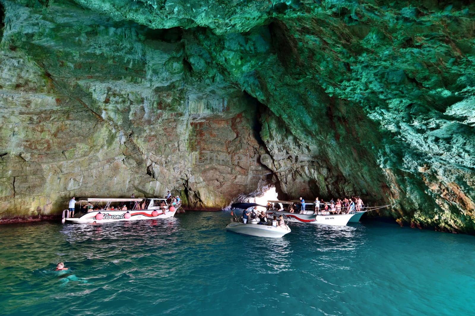 Kotor, Montenegro - June 10. 2019. Boats with tourists in Blue Cave , tourist attraction