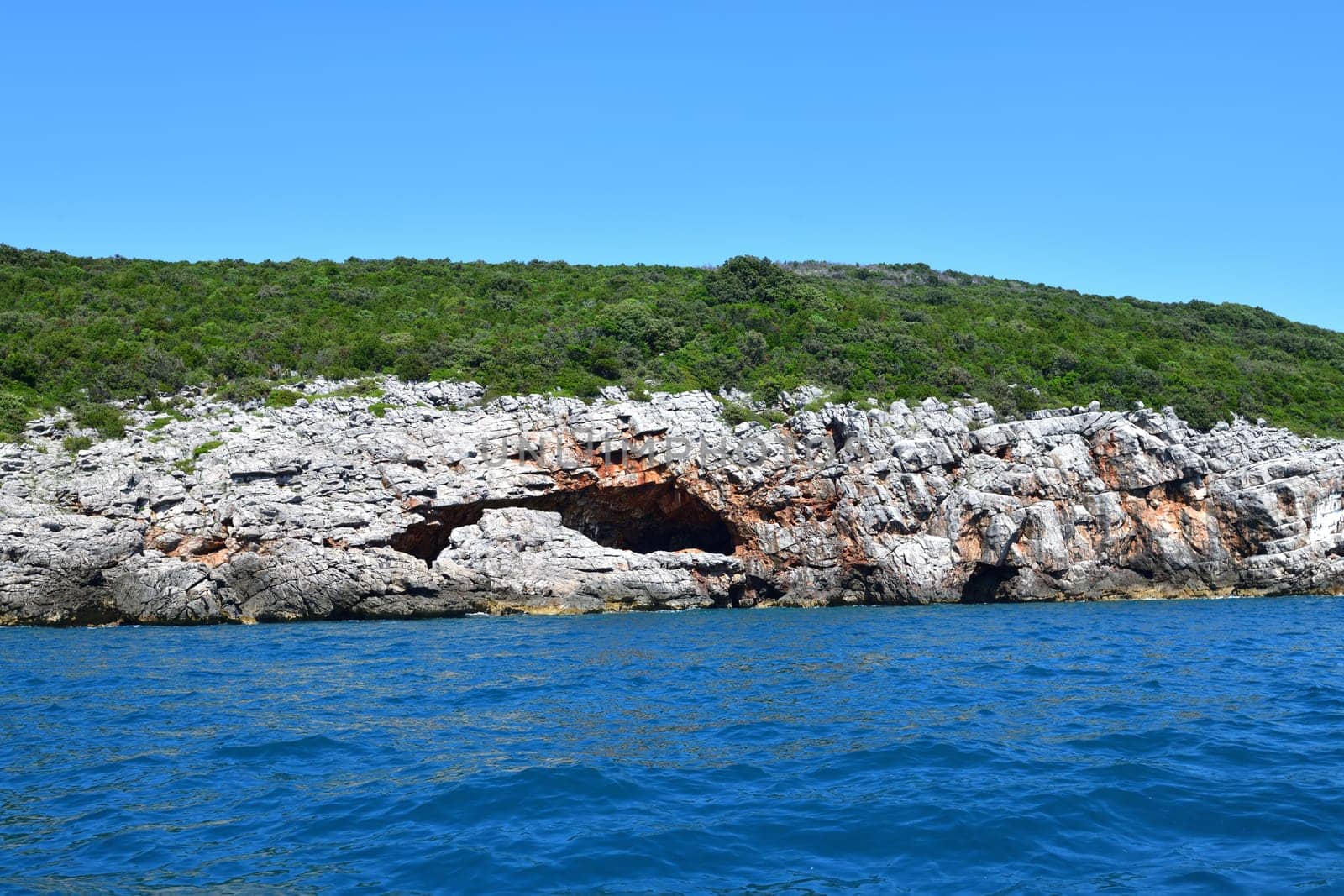 Cave in the rock on seashore in Montenegro