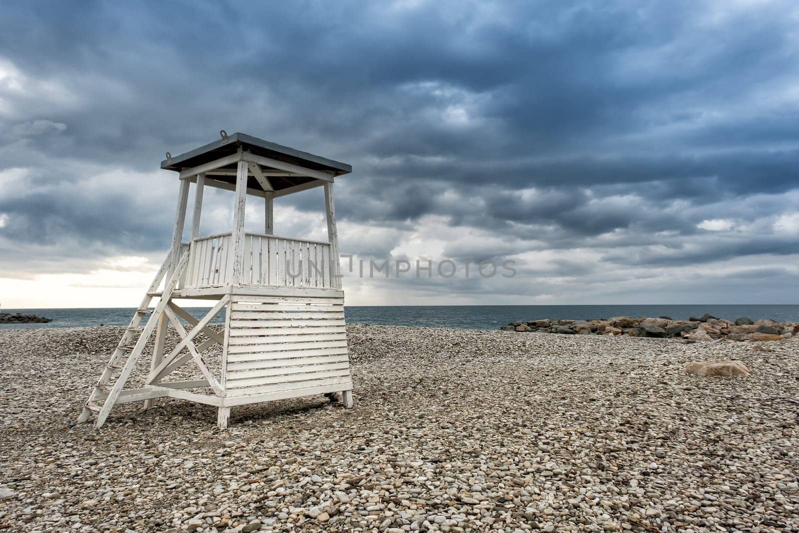 Lifeguard tower on the city beach in the morning before the rain in the resort village of Nebug, Krasnodar Territory, Russia..