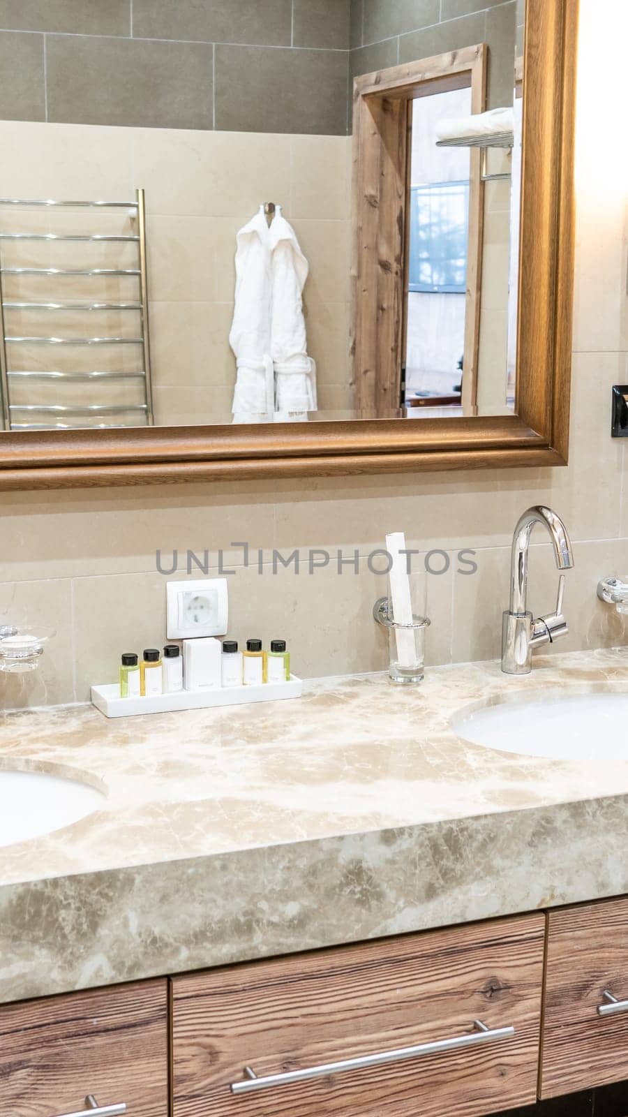 Luxury bathroom with brown tiles