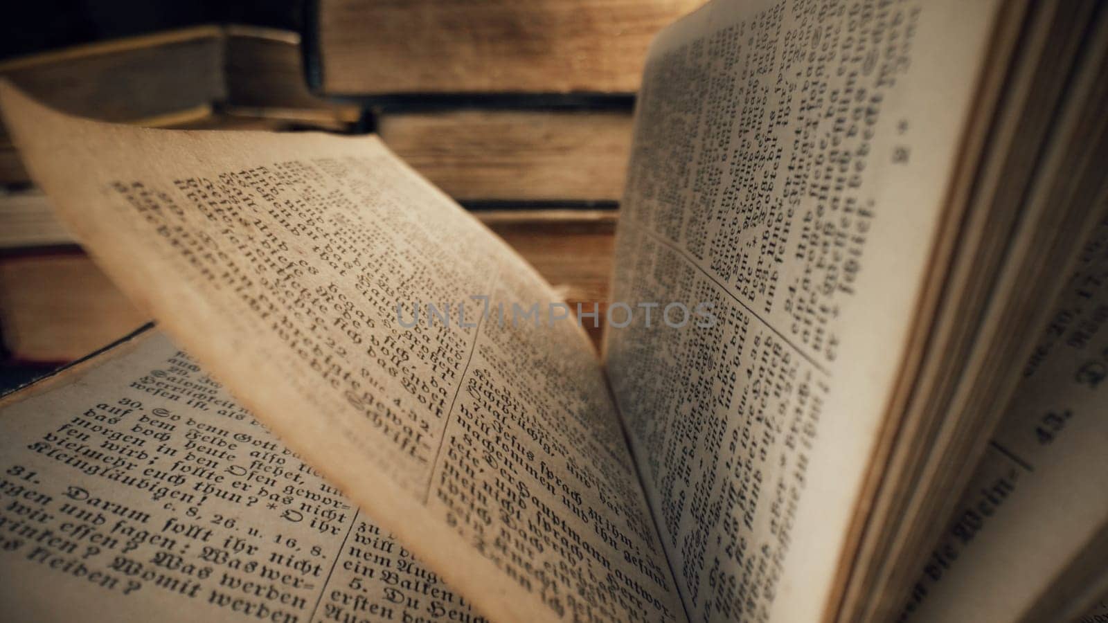 Macro of German Holy Bible. The Gospel, spiritual teachings for Christian. Old pages of ancient book. Religious literature concept. High quality