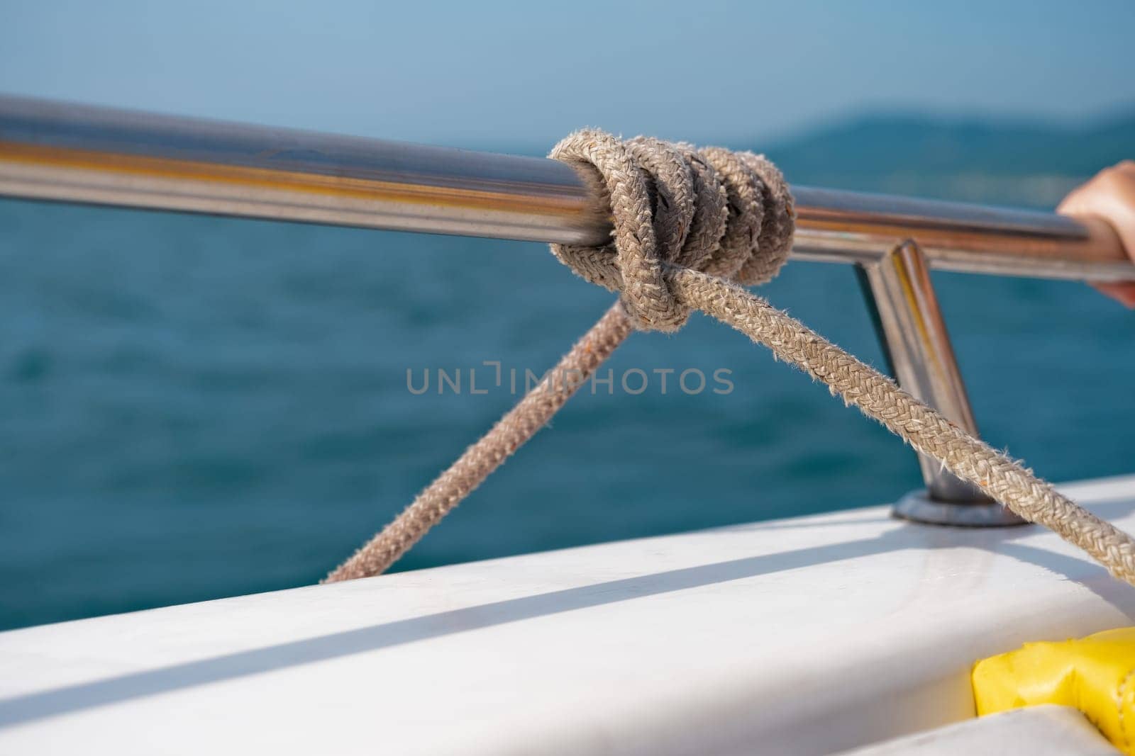Marine knot detail on stainless steel boat railing banister by NataliPopova