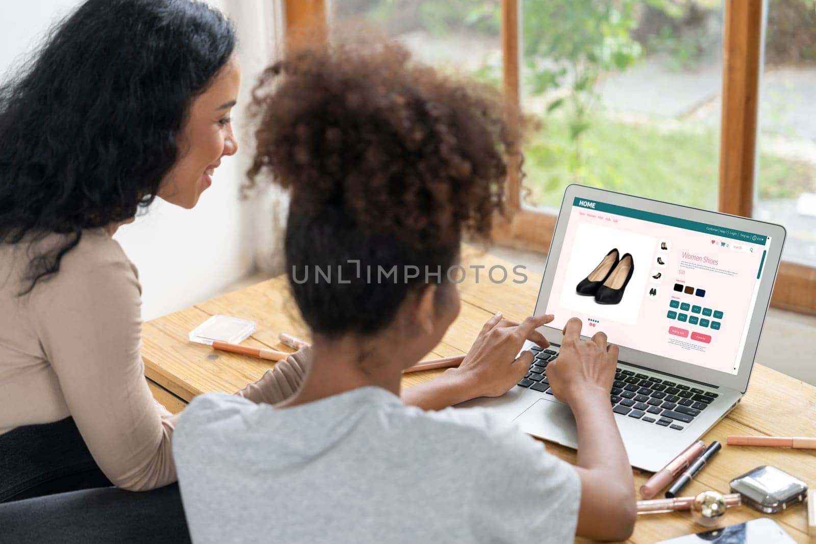 Woman shopping online on internet marketplace browsing for sale items for modern lifestyle and use credit card for online payment from wallet protected by crucial cyber security software