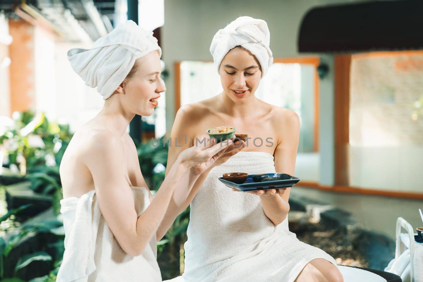 Couple of beautiful girls interested in homemade facial mask.Tranquility. by biancoblue